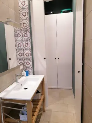 a bathroom with a sink and a mirror at La casa nel Borgo in Scopello