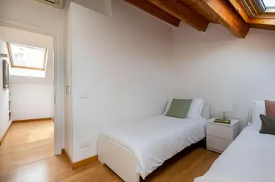 a hallway with white walls and a wooden ceiling at Vittorio Emanuele apartment with terrace by Wonderful Italy in Palermo