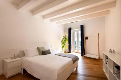 a hallway with a kitchen with pictures on the wall at Vittorio Emanuele apartment with terrace by Wonderful Italy in Palermo
