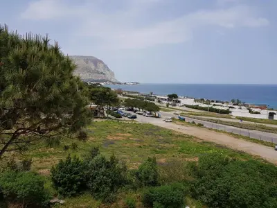 a view of a road next to the ocean at Addaura Village e Congressi in Mondello