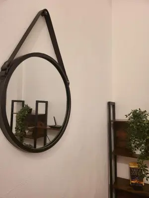 a room with a table and chairs and a dining room at Giovenchi’s Apartment in Palermo