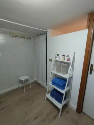 a room with a ladder and a table and a shelf at Casa Costantino in Alcamo
