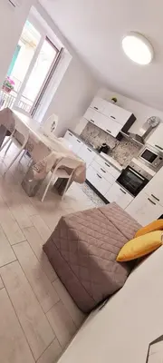 a living room with a couch and a table at Via Roma 35 Apartament in Monreale