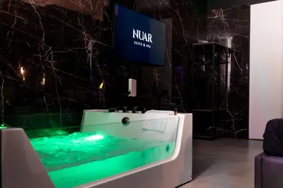 a bedroom with a bed with towels on it at Nuar suite&spa in Palermo