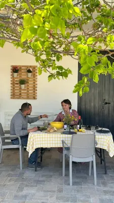 a couple of people sitting at a table at Elima's Mood in Scopello