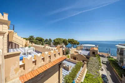 an aerial view of a building with the ocean in the background at I Merli sull'acqua - Suite in Palermo