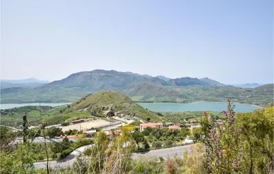 a view of a town with a lake and mountains at Cozy Home In Caccamo With Kitchenette in Caccamo