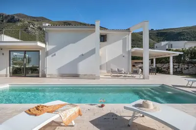 a swimming pool in front of a house at Villa Costamante con piscina privata in Balata di Baida