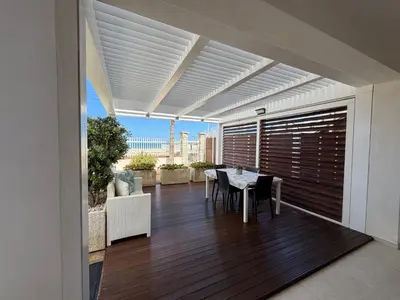 a room with two bunk beds and a floor at Casa sulla spiaggia in Castellammare del Golfo