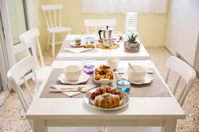 a white table with food on top of it at Ciatu mè in Alcamo