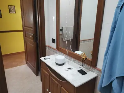 a bathroom with a sink and a shower at B&B La Fenice in Termini Imerese