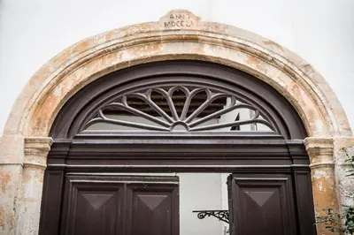 an archway over a door in a building at Residence Torremuzza - Charming House In The Heart Of Palermo with lovely view in Palermo
