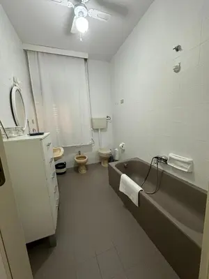 a bathroom with a tub and a toilet and a sink at Le stanze di Anna in Capaci