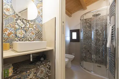 a bathroom with a sink and a shower at Bed and Breakfast Nilu' in Castellammare del Golfo