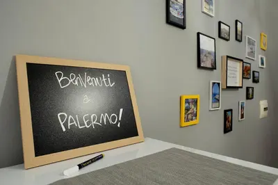 a chalkboard with the words benjamini and paralleling on a wall at La Boucherie in Palermo
