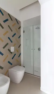 a bathroom with a toilet and a sink at La casetta in centro storico: Pantelleria 9 in Palermo