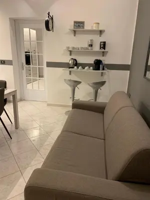 a living room with a couch and a table at Loft Nataly in Palermo