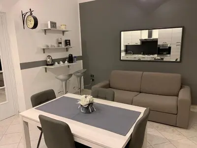 a living room with a table and a couch at Loft Nataly in Palermo