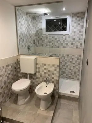 a bathroom with a toilet and a sink at Loft Nataly in Palermo