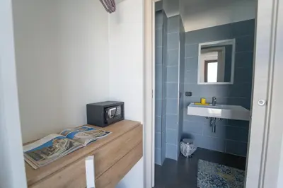 a small bathroom with a sink and a mirror at B&b Villa Cusenza in Partinico
