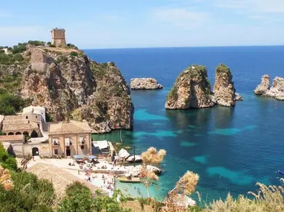 a group of rocks in a body of water at Villa Bouganville - charming sea ​​view- 160 mq in Alcamo