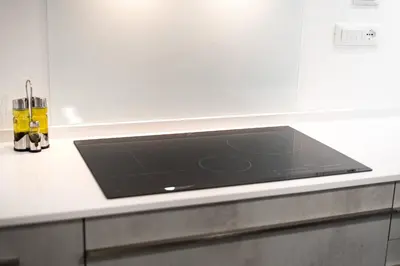 a kitchen counter with a black stove top at Casa di Dada - statua in Palermo