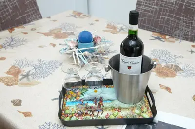 a tray with a statue on a table in a room at il tramonto in Capaci