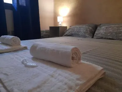 two towels on a bed in a room at La Cycas in Trabia