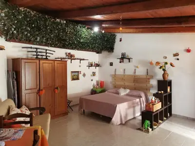 a bedroom with a bed in a room at Appartamento Green Room in Palermo