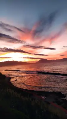 a sunset on the beach with the ocean at Casa Vacanza Accetta in Trappeto