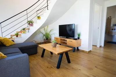 a living room with a tv and a coffee table at Villa Arianna, il piacere di vivere nella natura. in Alcamo