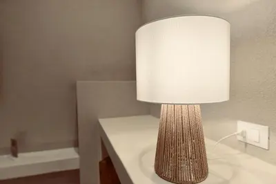 a lamp sitting on a table in a room at Palermo Inn Collection - Boutique Art Hotel in Palermo