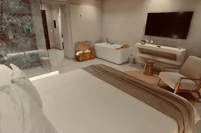 a bedroom with a large bed and a tv at Palermo Inn Collection - Boutique Art Hotel in Palermo