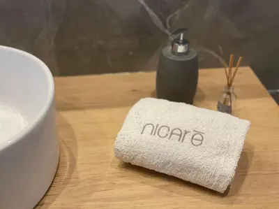 a napkin sitting on a table next to a coffee mug at Nicarè City Apartments in Palermo
