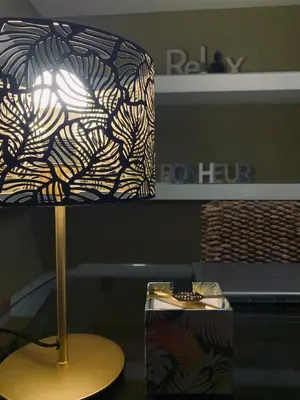 a lamp sitting on a table next to a laptop at B&B Ungheria Ottantaquattro in Palermo