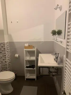 a bathroom with a toilet and a sink at La Casa di Giulia in Palermo