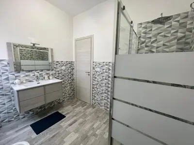 a bathroom with a shower and a sink at Il melograno in Carini