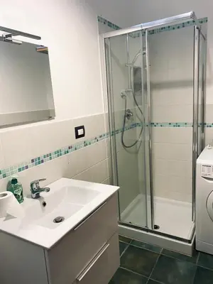 a bathroom with a sink and a shower at Casavacanze Alba in Alcamo