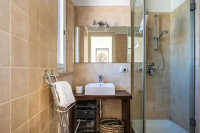 a bathroom with a sink and a shower at Attico nel cuore del centro storico di Palermo in Palermo