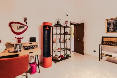 a room with a room with a shelf of shoes at Art House Arenella con Terrazze by Wonderful Italy in Palermo