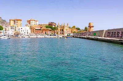 a large body of water with a city in the background at Art House Arenella con Terrazze by Wonderful Italy in Palermo