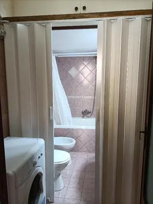a bathroom with a toilet and a bath tub at Casa di Lia in Montelepre