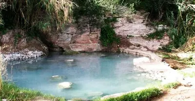 a pool of blue water with rocks in it at Il Girasole del Centro Storico in Alcamo