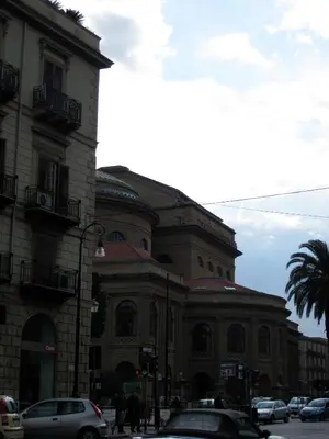 a large building with cars parked in front of it at Casa Cavour in Palermo