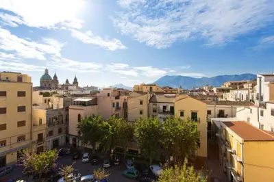 a view of a city with buildings and trees at Casa Cavour in Palermo