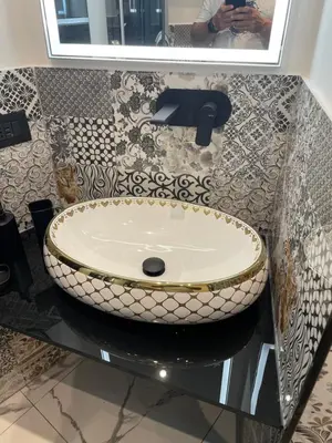 a bathroom with a sink on a counter with a mirror at Casa vacanze donna Pina in Palermo