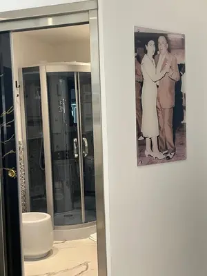 a picture of a couple standing in front of a mirror at Casa vacanze donna Pina in Palermo