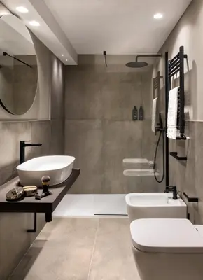 a bathroom with a tub and a toilet and a sink at Hotel Principe Di Villafranca in Palermo