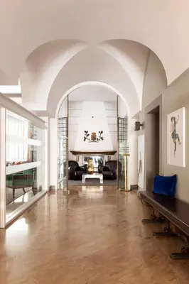 a living room with an archway and a fireplace at Hotel Principe Di Villafranca in Palermo