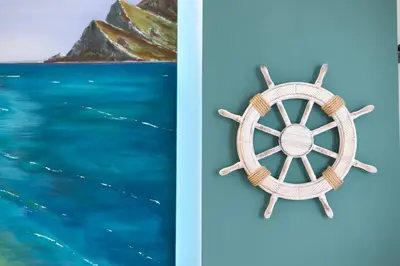a picture of a steering wheel and the ocean at PalerMonAmour Art Gallery Suite in Palermo